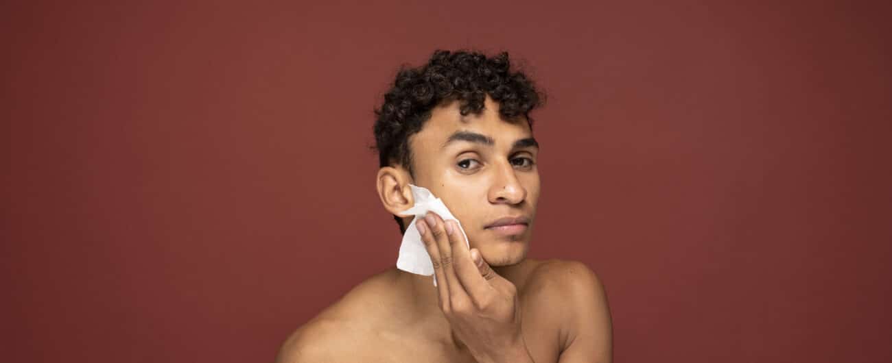 portrait-handsome-man-cleaning-his-face-with-tissue