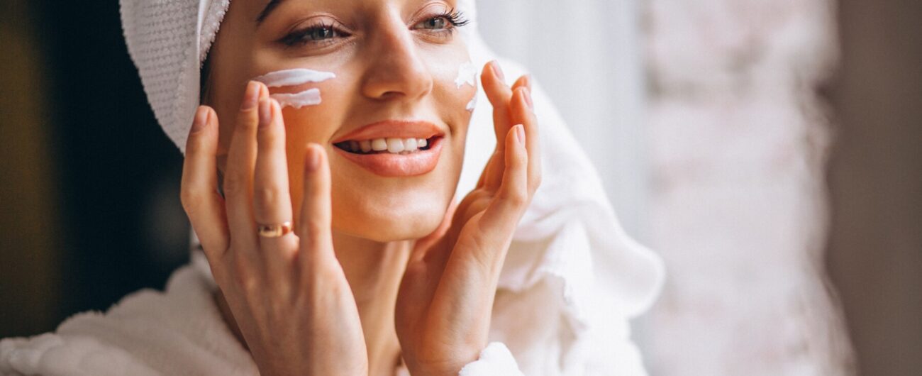 woman-applying-face-cream_1303-14311