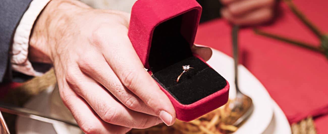 man-making-proposal-festive-table
