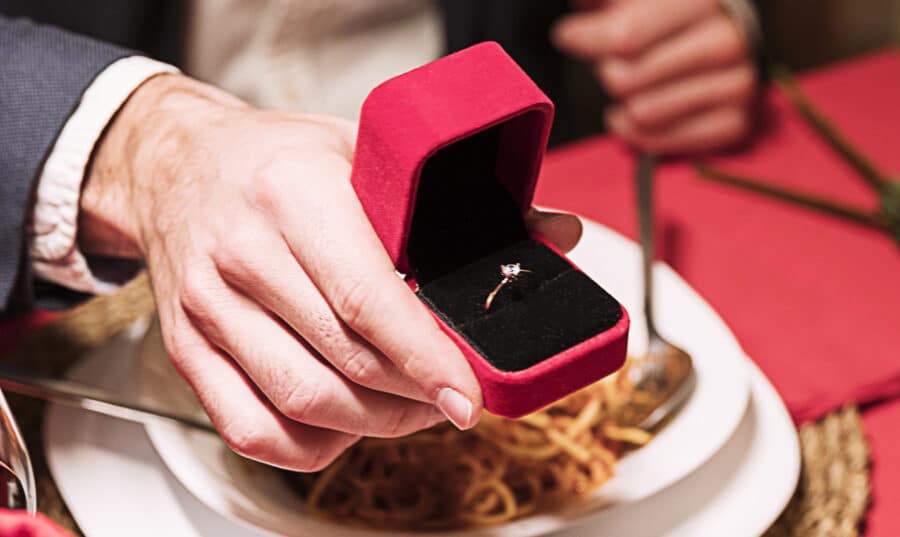 man-making-proposal-festive-table