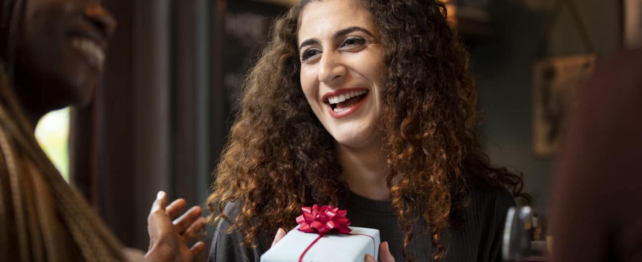close-up-smiley-woman-receiving-gift