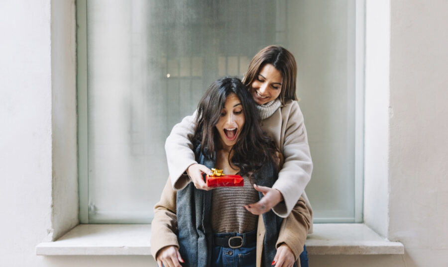 excited-woman-getting-present-from-girlfriend